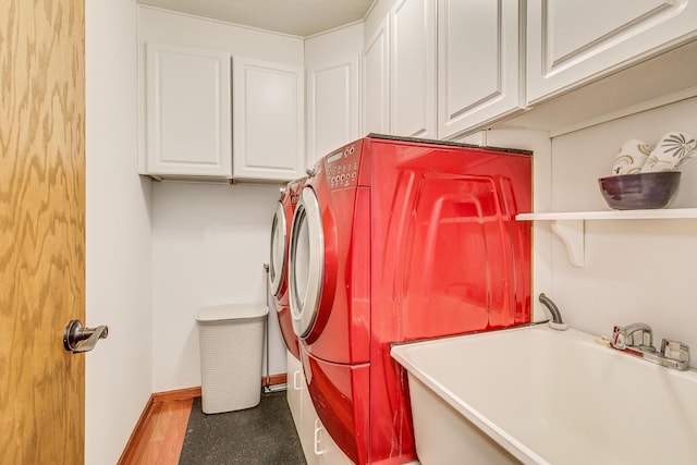 3948 Orchid Ln N, Plymouth, MN 55446 - washroom featuring independent washer and dryer, cabinet space, and baseboards