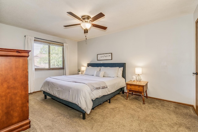 3948 Orchid Ln N, Plymouth, MN 55446 - bedroom with light carpet, baseboards, and a ceiling fan