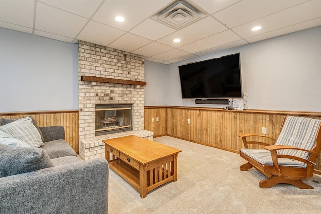 3948 Orchid Ln N, Plymouth, MN 55446 - carpeted living area featuring a paneled ceiling, a wainscoted wall, a fireplace, and recessed lighting