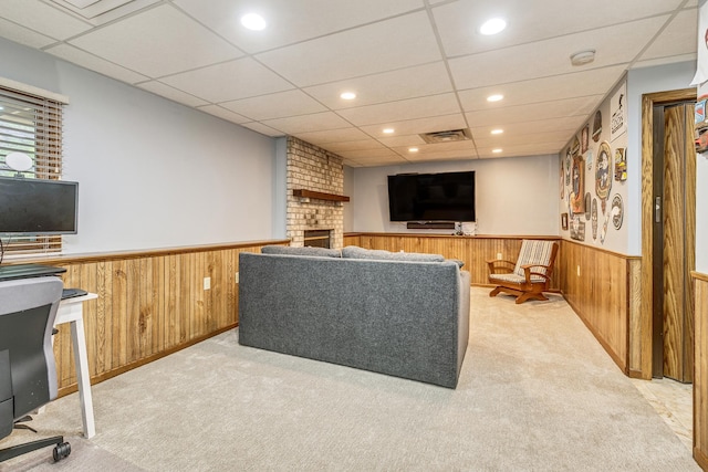 3948 Orchid Ln N, Plymouth, MN 55446 - living area featuring a wainscoted wall, light colored carpet, a fireplace, wood walls, and recessed lighting