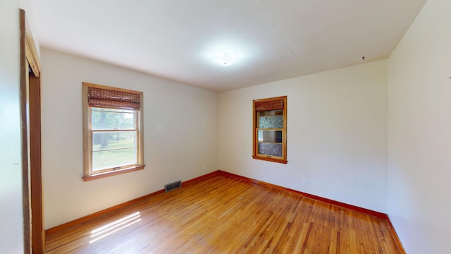 706 19th St, Albert Lea, MN 56007 - spare room featuring light wood-style floors and baseboards