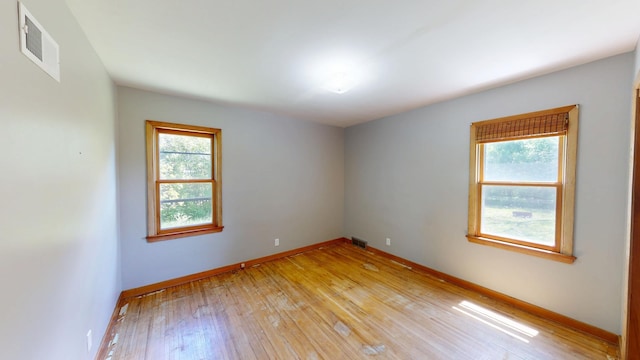 706 19th St, Albert Lea, MN 56007 - unfurnished room with light wood-style floors and baseboards