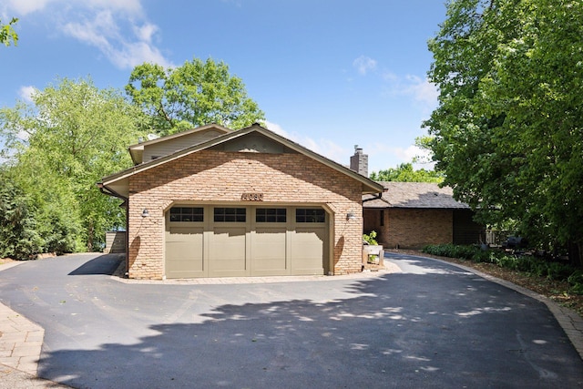4080 Lotus Dr, Minnetrista, MN 55331 - view of front of house featuring a chimney and brick siding