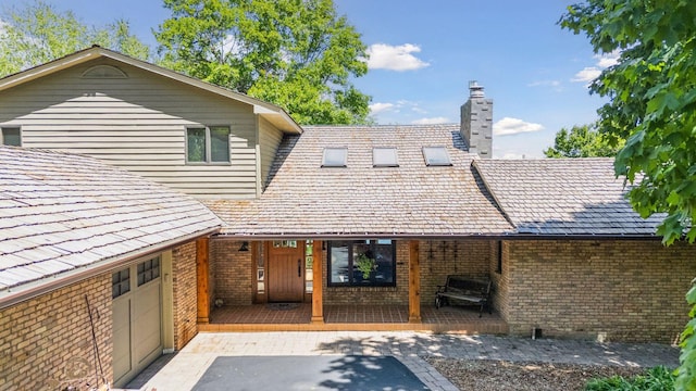 4080 Lotus Dr, Minnetrista, MN 55331 - back of house with brick siding and a chimney
