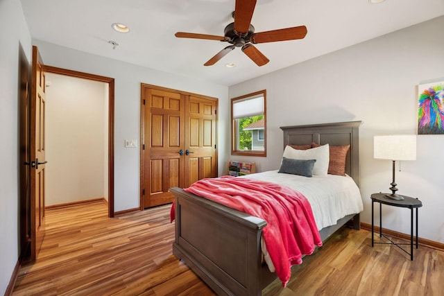 4080 Lotus Dr, Minnetrista, MN 55331 - bedroom with light wood finished floors, baseboards, recessed lighting, and a closet
