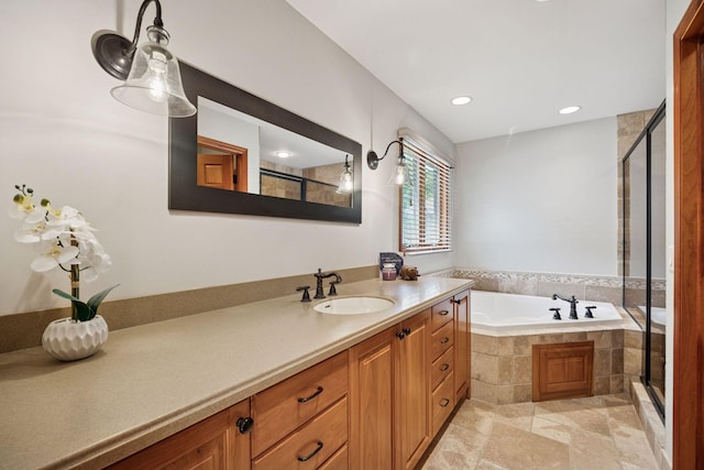 4080 Lotus Dr, Minnetrista, MN 55331 - bathroom with vanity, a stall shower, a bath, recessed lighting, and stone finish floors