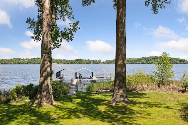 4080 Lotus Dr, Minnetrista, MN 55331 - dock featuring a water view, a yard, and boat lift