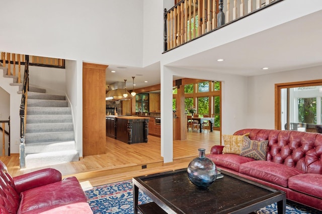 4080 Lotus Dr, Minnetrista, MN 55331 - living area with healthy amount of natural light, light wood finished floors, and stairs