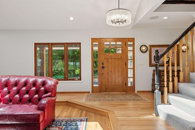 4080 Lotus Dr, Minnetrista, MN 55331 - foyer entrance with baseboards, a chandelier, stairway, wood finished floors, and recessed lighting