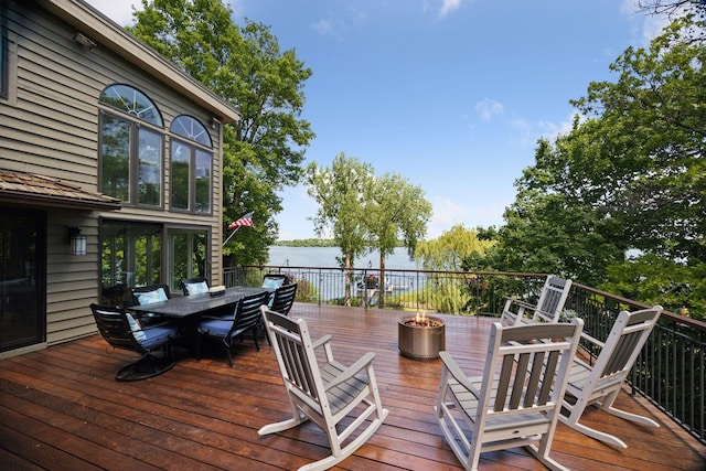 4080 Lotus Dr, Minnetrista, MN 55331 - deck with an outdoor fire pit, outdoor dining space, and a water view