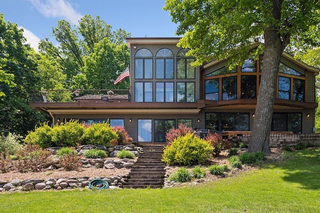 4080 Lotus Dr, Minnetrista, MN 55331 - rear view of property featuring a yard, stairway, and a sunroom