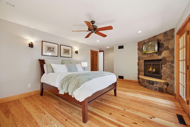 4080 Lotus Dr, Minnetrista, MN 55331 - bedroom featuring a fireplace, light wood-type flooring, baseboards, recessed lighting, and ceiling fan