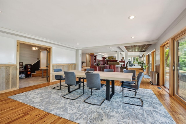 4080 Lotus Dr, Minnetrista, MN 55331 - dining area featuring light wood-style flooring, a wainscoted wall, crown molding, and recessed lighting