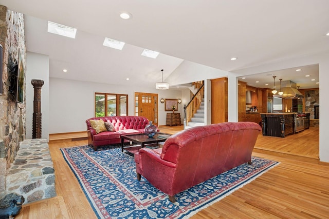 4080 Lotus Dr, Minnetrista, MN 55331 - living area with stairs, light wood-type flooring, a skylight, recessed lighting, and lofted ceiling