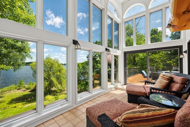 4080 Lotus Dr, Minnetrista, MN 55331 - sunroom with tile patterned floors, a high ceiling, and a water view