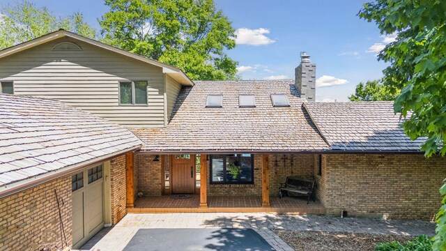 4080 Lotus Dr, Minnetrista, MN 55331 - entrance to property with brick siding and a chimney