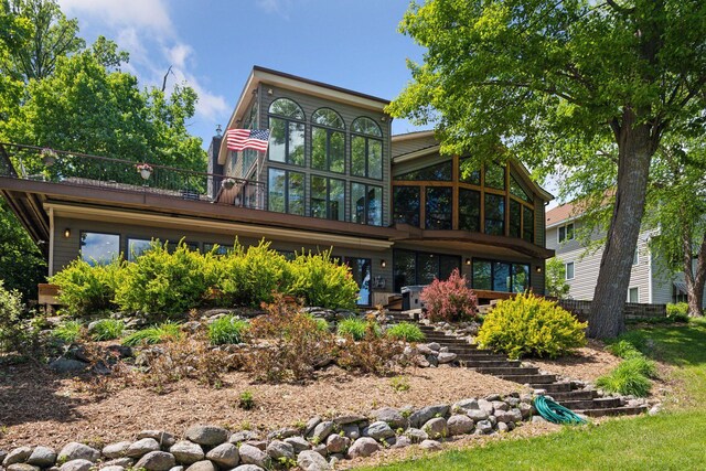 4080 Lotus Dr, Minnetrista, MN 55331 - back of house with a sunroom and stairs