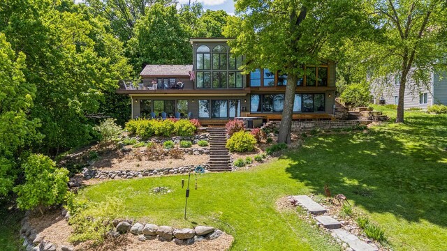 4080 Lotus Dr, Minnetrista, MN 55331 - back of house featuring stairs, a lawn, and a balcony