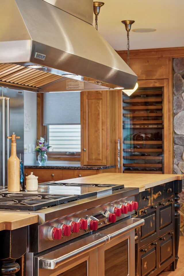 4080 Lotus Dr, Minnetrista, MN 55331 - kitchen featuring exhaust hood, double oven range, and wooden counters