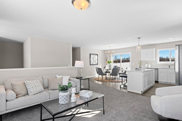 2135 Violet Ln, Faribault, MN 55021 - living room featuring dark wood-type flooring and a chandelier