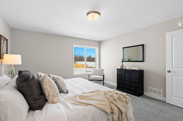 2135 Violet Ln, Faribault, MN 55021 - bedroom featuring carpet floors, baseboards, and a textured ceiling