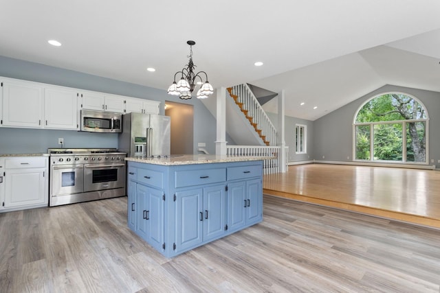1901 Lexington Ave S, Mendota Heights, MN 55118 - kitchen with premium appliances, light wood finished floors, white cabinetry, lofted ceiling, and pendant lighting