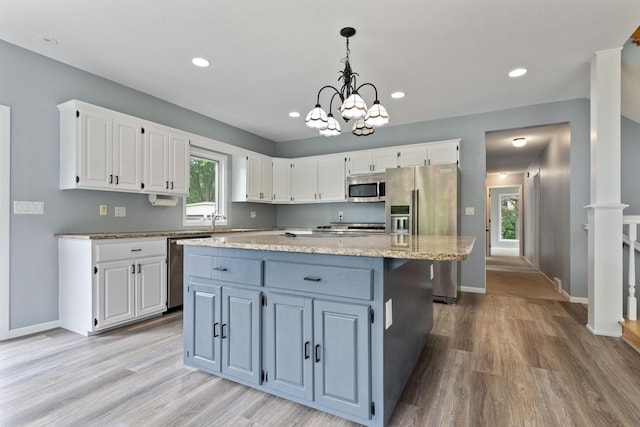 1901 Lexington Ave S, Mendota Heights, MN 55118 - kitchen with stainless steel appliances, white cabinets, light wood-style flooring, baseboards, and recessed lighting