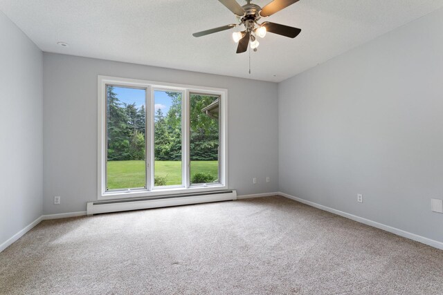 1901 Lexington Ave S, Mendota Heights, MN 55118 - carpeted spare room with baseboard heating, baseboards, and a ceiling fan