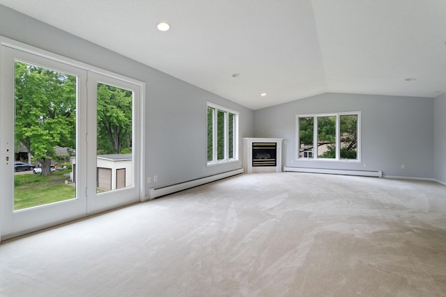 1901 Lexington Ave S, Mendota Heights, MN 55118 - unfurnished living room featuring a baseboard heating unit, plenty of natural light, carpet flooring, and vaulted ceiling