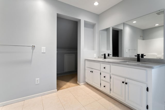 1901 Lexington Ave S, Mendota Heights, MN 55118 - bathroom featuring double vanity, tile patterned floors, baseboards, and recessed lighting
