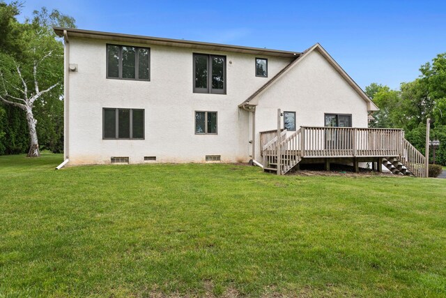 1901 Lexington Ave S, Mendota Heights, MN 55118 - rear view of property with stairway, a wooden deck, a lawn, and stucco siding