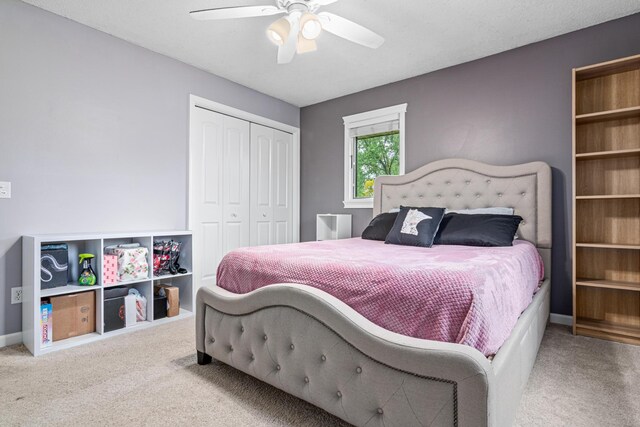 11508 Georgia Ave N, Champlin, MN 55316 - bedroom with carpet, a closet, ceiling fan, and baseboards