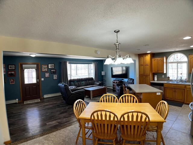 10306 Hemlock St NW, Annandale, MN 55302 - dining area with baseboard heating, plenty of natural light, a textured ceiling, and recessed lighting