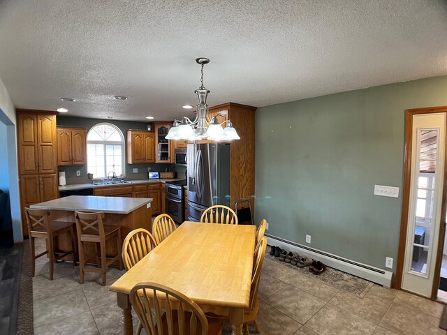 10306 Hemlock St NW, Annandale, MN 55302 - dining area with a textured ceiling, a chandelier, baseboard heating, recessed lighting, and light tile patterned flooring