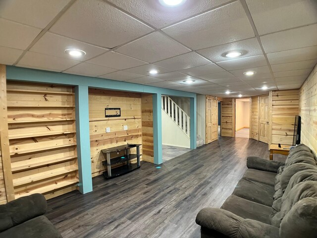10306 Hemlock St NW, Annandale, MN 55302 - living area with stairs, dark wood-type flooring, wood walls, and recessed lighting