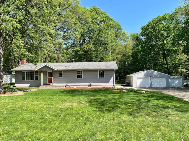 10306 Hemlock St NW, Annandale, MN 55302 - view of front of house featuring a detached garage, an outdoor structure, and a front lawn