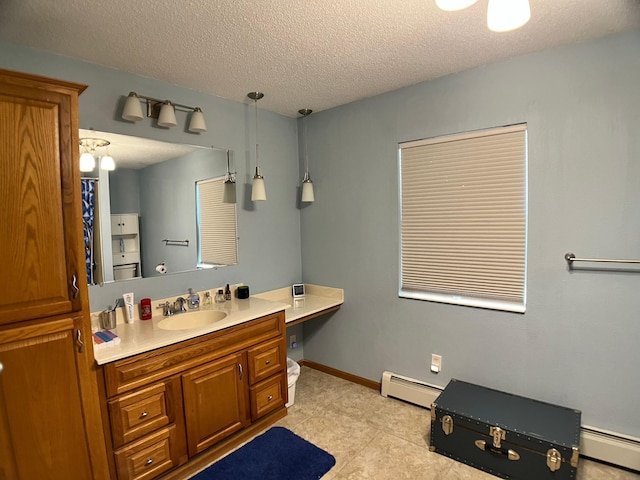 10306 Hemlock St NW, Annandale, MN 55302 - full bath featuring baseboard heating, vanity, a textured ceiling, and tile patterned floors