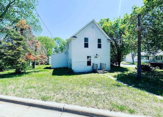 415 Francis St, Faribault, MN 55021 - view of property exterior with a yard