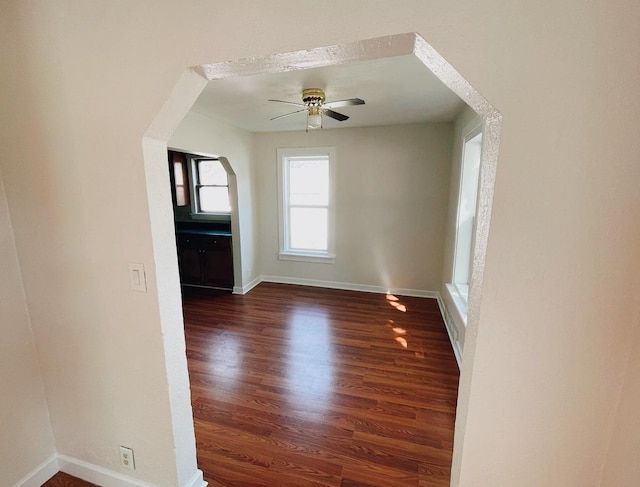 415 Francis St, Faribault, MN 55021 - foyer with dark wood-type flooring, baseboards, and ceiling fan