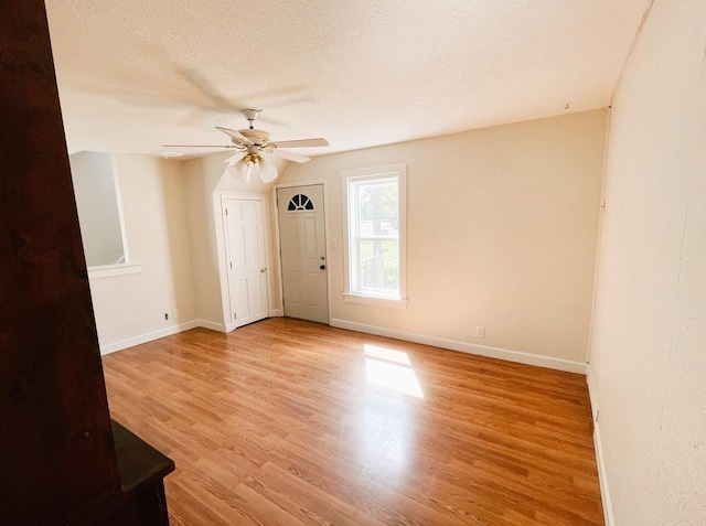 415 Francis St, Faribault, MN 55021 - spare room with ceiling fan, wood finished floors, baseboards, and a textured ceiling