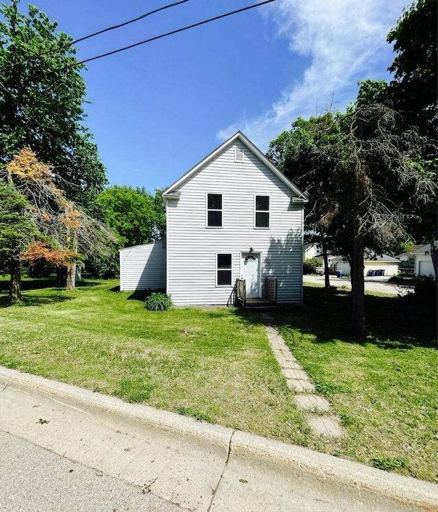 415 Francis St, Faribault, MN 55021 - view of property exterior with a lawn