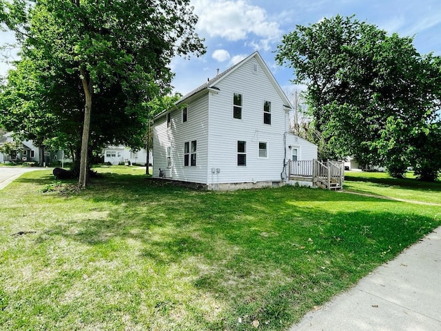 415 Francis St, Faribault, MN 55021 - view of home's exterior with a lawn and a wooden deck