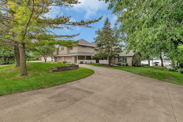 5386 165th St NE, Atwater, MN 56209 - traditional-style home with curved driveway, an attached garage, a front yard, and roof with shingles
