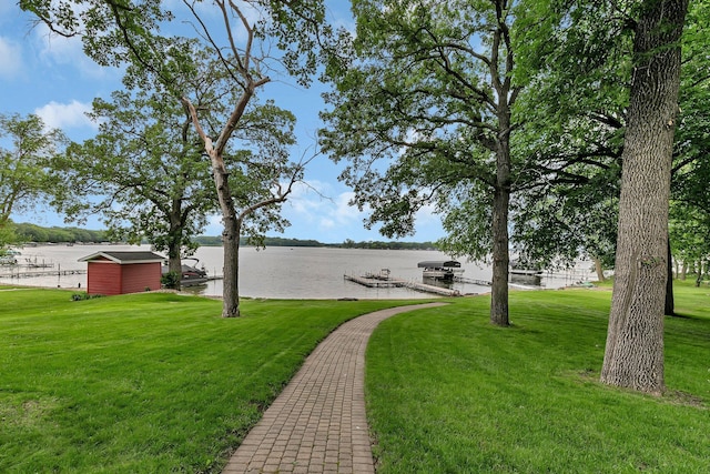 5386 165th St NE, Atwater, MN 56209 - view of green lawn with a boat dock, a water view, and boat lift
