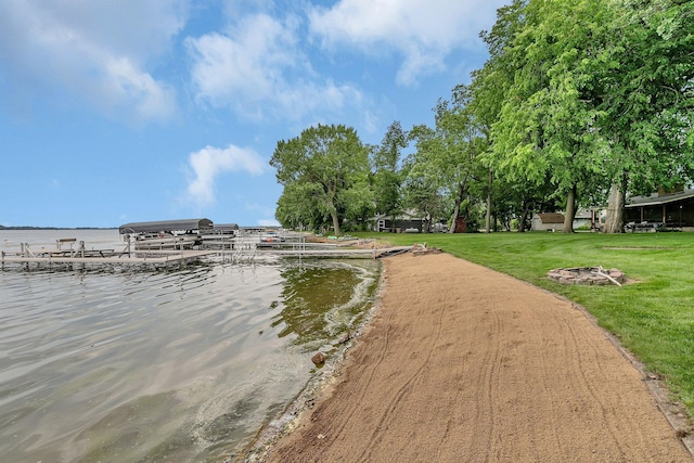 5386 165th St NE, Atwater, MN 56209 - view of home's community with a boat dock, a water view, and a yard