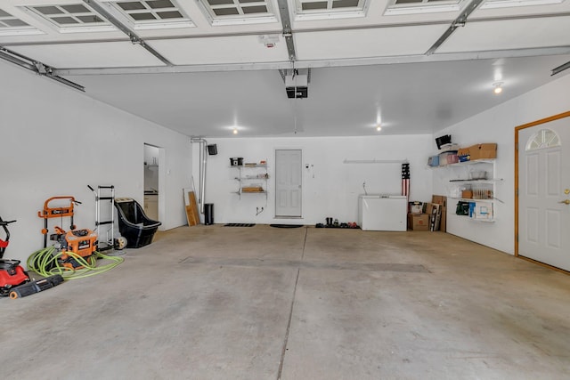 5386 165th St NE, Atwater, MN 56209 - garage featuring refrigerator and a garage door opener