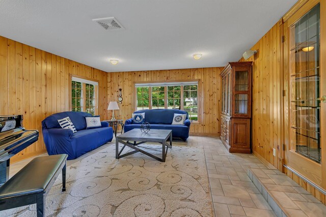 5386 165th St NE, Atwater, MN 56209 - living area with wooden walls, light stone finish floors, and baseboards