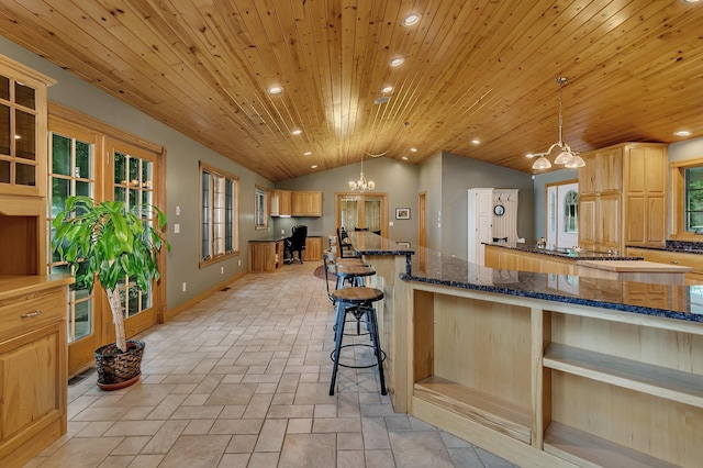 5386 165th St NE, Atwater, MN 56209 - kitchen with lofted ceiling, a chandelier, a large island, wood ceiling, and a breakfast bar area