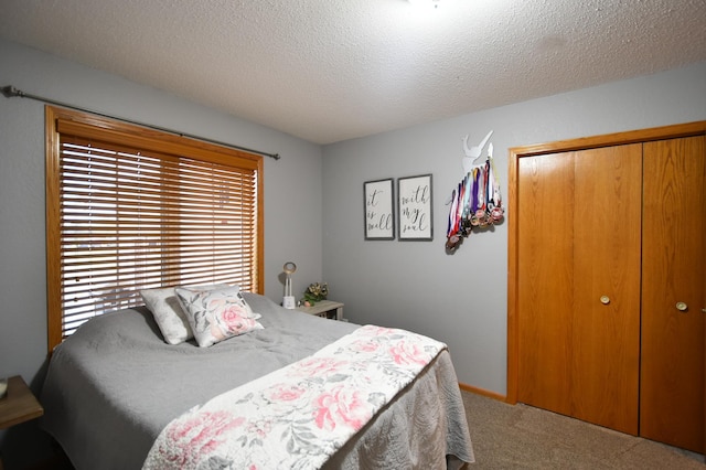 201 Ridge Dr, Kenyon, MN 55946 - carpeted bedroom with a closet and a textured ceiling