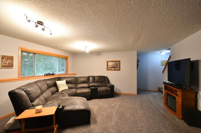 201 Ridge Dr, Kenyon, MN 55946 - carpeted living room with a textured ceiling and baseboards